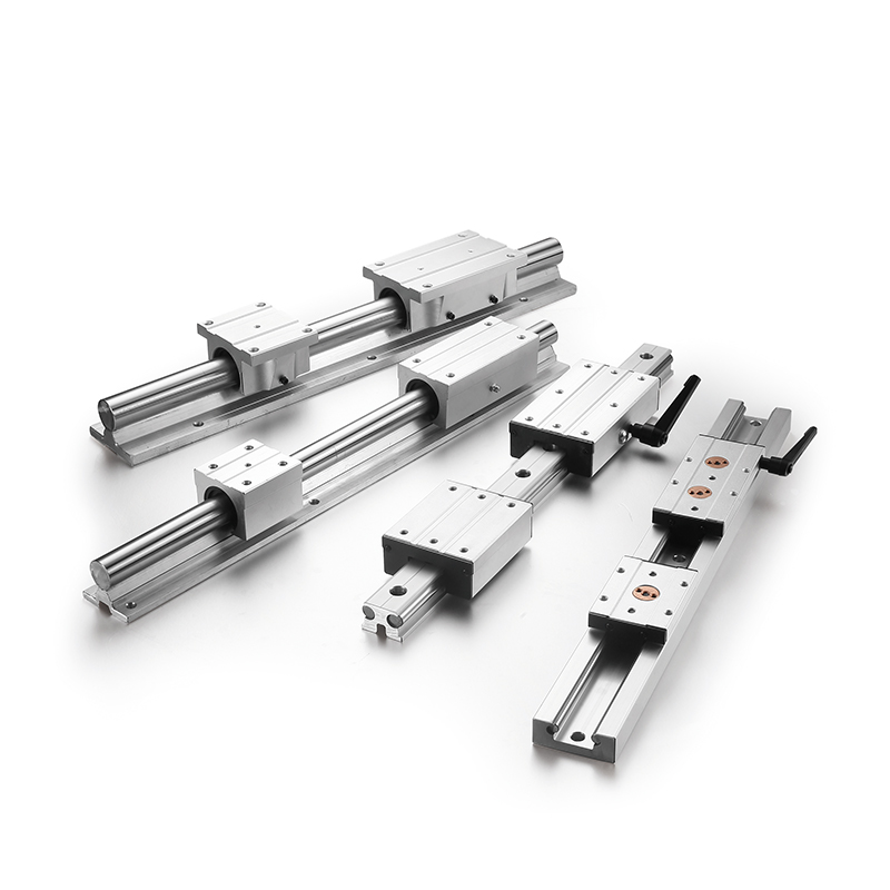 Different linear slide rail systems displayed with round shaft guides, carriage blocks and adjustable handles for flexible machine design.