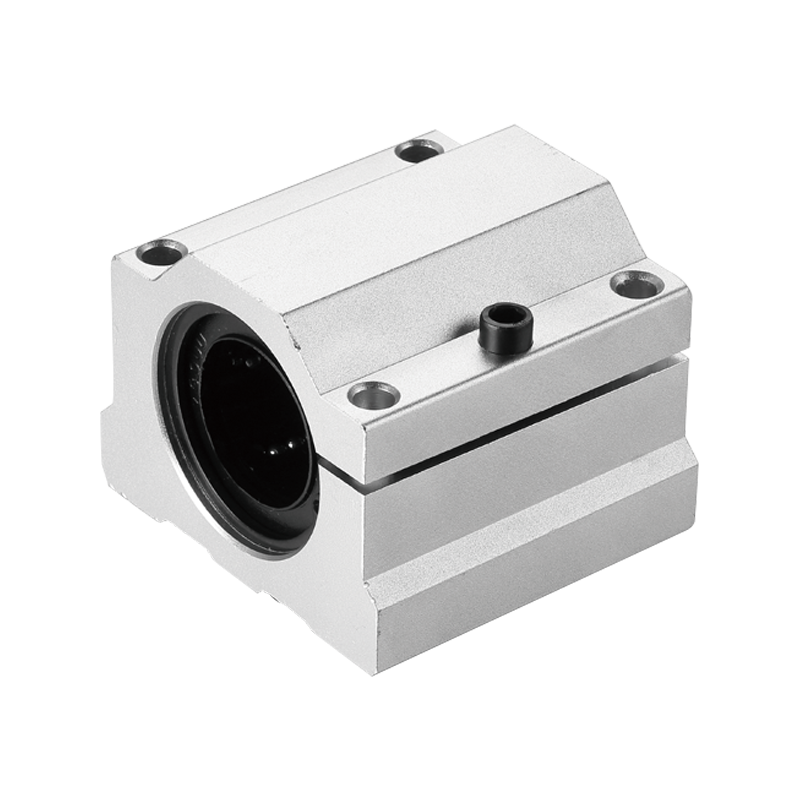 SCS AJ UU series adjustable slide unit with slotted aluminum housing and adjustment screw, designed for precise clearance control in round shaft linear motion systems.

