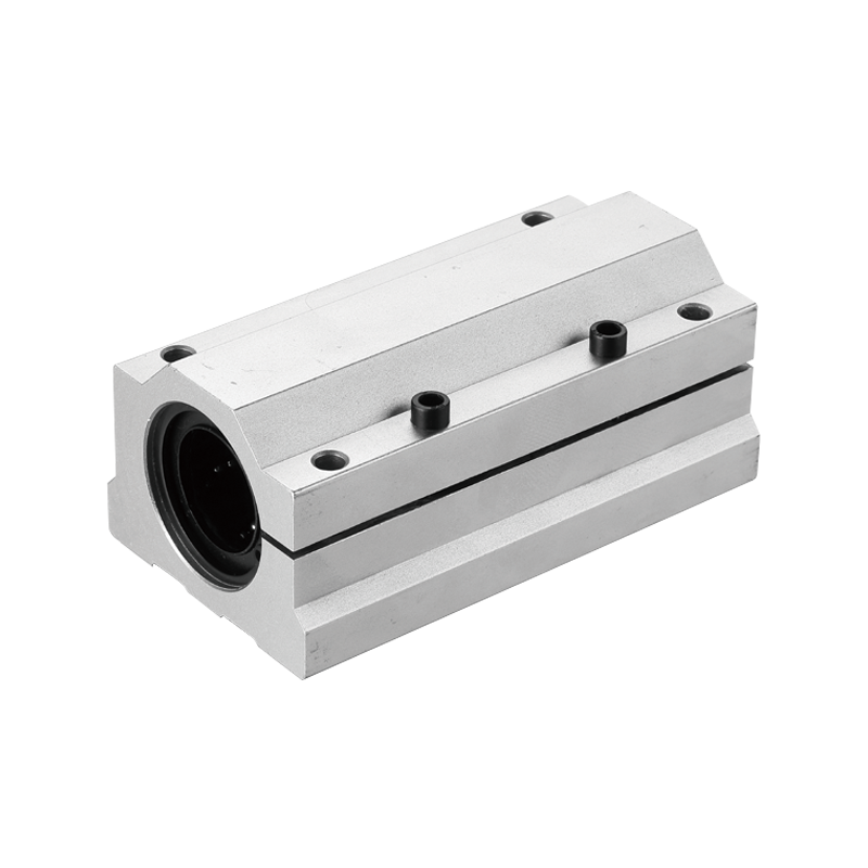 SCL AJL UU series adjustable aluminum slide unit with long slotted housing and adjustment screws, designed for clearance control in round shaft linear motion systems.